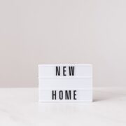 A sign that says New Home