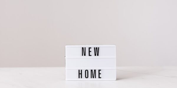 A sign that says New Home